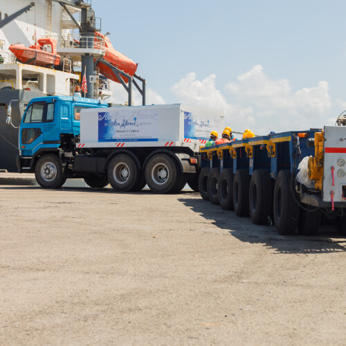 Trucks transporting container boxes in the yard