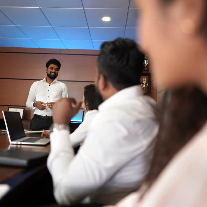 A trainer giving instructions to new joiners