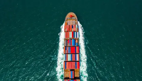 Aerial top view from drone, Cargo vessel sail to the sea with peaceful wave