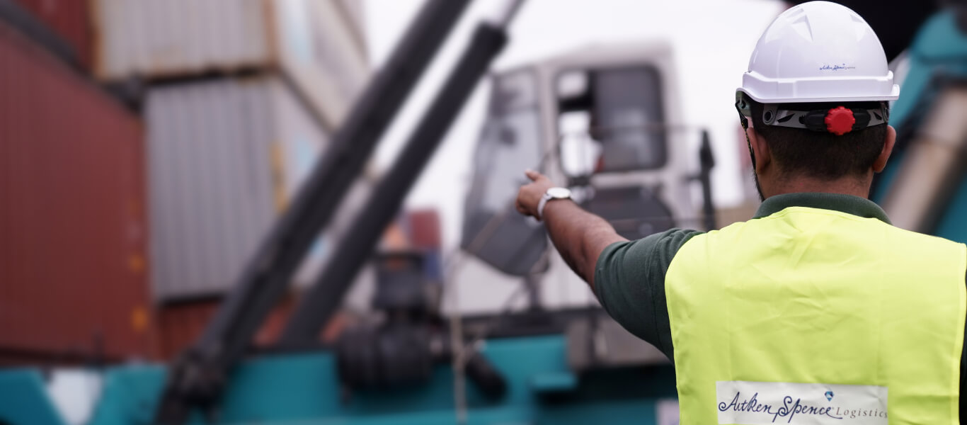 A controller is giving instructions for machine workers